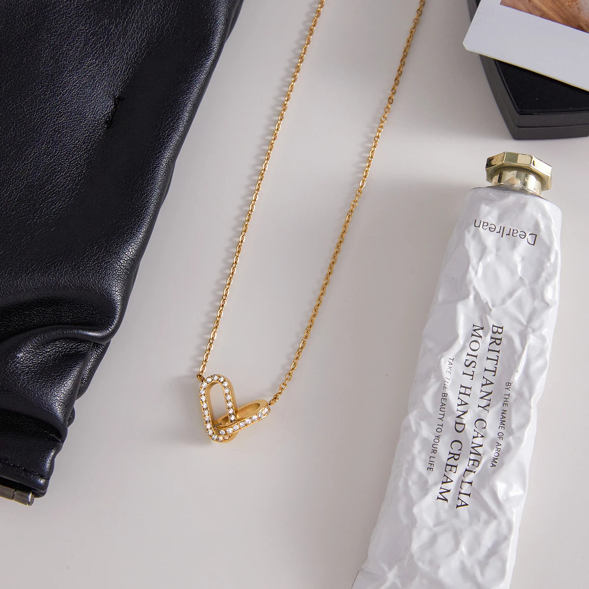 Uworld Personalized Classic Stainless Steel White Zirconia Double Ring Elliptical Geometric Ring Interlocking Pendant Necklace 1